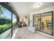 Spacious screened porch overlooking the backyard at 2383 Indian E Trl, Palm Harbor, FL 34683