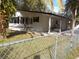 Newly remodeled manufactured home with carport and fenced yard at 10040 Jungle St, New Port Richey, FL 34654