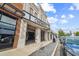 Inviting storefront featuring a brick and stucco facade with an open-air promenade and plenty of parking spaces at 102 S Moody Ave # 3, Tampa, FL 33609