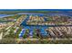 Awe-inspiring aerial view of the waterfront community with nearby beaches, canals, and blue roofs at 1688 Watermark Ne Cir # 1688, St Petersburg, FL 33702