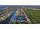 Stunning aerial view of waterfront condos with boat docks on canals near lush greenery and the Gulf at 1688 Watermark Ne Cir # 1688, St Petersburg, FL 33702