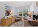 Comfortable office space featuring a stylish rug, neutral tones, and ample natural light for a productive work environment at 1688 Watermark Ne Cir # 1688, St Petersburg, FL 33702