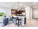 Modern kitchen featuring stainless steel appliances and a breakfast bar at 174 Green Oak Park, Rotonda West, FL 33947