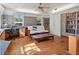 Home office with built-in bookshelves, hardwood floors, and a comfortable futon at 5021 24Th S Ave, Gulfport, FL 33707
