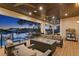 Relaxing back patio with fire pit, seating area, and waterfront views at 5104 Homer W Ave, Tampa, FL 33629