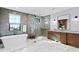 Elegant bathroom with a soaking tub, glass shower, and marble floors at 5104 Homer W Ave, Tampa, FL 33629