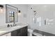 Bathroom with white subway tile shower and dark wood vanity at 5104 Homer W Ave, Tampa, FL 33629