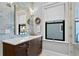 Bathroom with a dark vanity and blue tile at 5104 Homer W Ave, Tampa, FL 33629