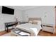 Bedroom with a desk, bed, and light wood furniture at 5104 Homer W Ave, Tampa, FL 33629