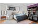 Bedroom featuring a plaid comforter, bookcase, and armchair at 5104 Homer W Ave, Tampa, FL 33629