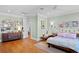 Charming bedroom with hardwood floors, gallery wall, and wood furniture at 5104 Homer W Ave, Tampa, FL 33629