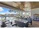 Relaxing covered patio with fire pit, seating area, and waterfront views at 5104 Homer W Ave, Tampa, FL 33629
