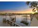 Serene waterfront dock with seating and sunset view at 5104 Homer W Ave, Tampa, FL 33629