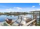 Relaxing waterfront dock with seating and views at 5104 Homer W Ave, Tampa, FL 33629