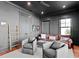 Media room with leather sofas and a large TV at 5104 Homer W Ave, Tampa, FL 33629