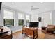 Home office with a large desk, comfortable chair, and hardwood floors at 5104 Homer W Ave, Tampa, FL 33629