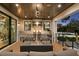 Covered patio with outdoor kitchen, fire pit, and seating at 5104 Homer W Ave, Tampa, FL 33629