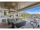 Outdoor kitchen with stainless steel appliances, fire pit, and water view at 5104 Homer W Ave, Tampa, FL 33629
