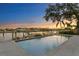 Relaxing rectangular pool with light-colored tile and a tranquil waterfront view at 5104 Homer W Ave, Tampa, FL 33629