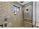 Spa-like shower with patterned tile and a built-in seat at 5104 Homer W Ave, Tampa, FL 33629