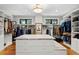 Bright walk-in closet with custom shelving and a granite countertop at 5104 Homer W Ave, Tampa, FL 33629