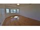 Bedroom with bay window, light wood floors, and white walls at 19212 Grange Hall Loop, Wimauma, FL 33598