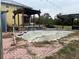 Above ground pool with surrounding patio needing some work at 19212 Grange Hall Loop, Wimauma, FL 33598