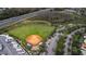 Community baseball field with parking and RV storage at 5124 Highland Pointe Ct, Wimauma, FL 33598