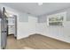 Light and airy bedroom with white wainscoting and hardwood floors at 4290 Yucatan Cir, Port Charlotte, FL 33948