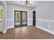 Bright dining room with hardwood floors and French doors at 4290 Yucatan Cir, Port Charlotte, FL 33948