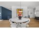 Modern dining room with white tulip table and chairs at 275 44Th Ave, St Pete Beach, FL 33706