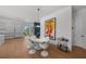 Modern dining room with white table and chairs, near kitchen at 275 44Th Ave, St Pete Beach, FL 33706