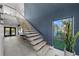 Modern entryway with glass staircase and open floor plan, creating a bright and airy feel at 275 44Th Ave, St Pete Beach, FL 33706