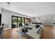 Light and airy living room with wall of sliding glass doors at 275 44Th Ave, St Pete Beach, FL 33706