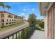 Private balcony overlooking a tree-lined street and neighboring buildings at 290 Valencia Cir, St Petersburg, FL 33716