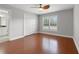 Well-lit bedroom with wood flooring and double door closet at 290 Valencia Cir, St Petersburg, FL 33716