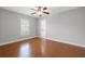 Spacious bedroom featuring wood flooring and a private bathroom at 290 Valencia Cir, St Petersburg, FL 33716