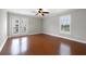 Bright bedroom with wood floors and private balcony access at 290 Valencia Cir, St Petersburg, FL 33716