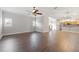 Open living room with hardwood floors and kitchen view at 290 Valencia Cir, St Petersburg, FL 33716