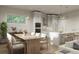 Kitchen and dining area with farmhouse table and white kitchen cabinets at 3801 71St N St, St Petersburg, FL 33709