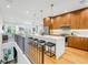 Modern kitchen with white quartz countertops and wood cabinets at 460 87Th Avenue North, St Petersburg, FL 33702