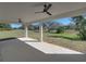 Covered patio with ceiling fans offering a view of the backyard at 5364 Boxtree Ct, Dade City, FL 33523