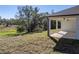 Covered patio with a ceiling fan and a view of the backyard at 5364 Boxtree Ct, Dade City, FL 33523