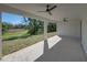 Covered patio with ceiling fans and a view of the backyard at 5364 Boxtree Ct, Dade City, FL 33523