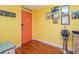 Bright entryway with coral door and nautical-themed decor at 5605 Shore S Blvd # B, Gulfport, FL 33707