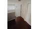 Upstairs hallway with hardwood floors and doors at 1102 W Charter St, Tampa, FL 33602