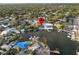 Aerial view of waterfront home with private dock and boats at 4722 Trade Winds S Dr, Gulfport, FL 33711