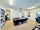 Community game room with a pool table and bookcases at 4910 Bay Ne St # 309, St Petersburg, FL 33703