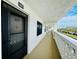 Bright hallway with access to condo unit, showing building exterior at 4910 Bay Ne St # 309, St Petersburg, FL 33703