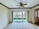 Bright living room with sliding glass doors leading to a balcony at 4910 Bay Ne St # 309, St Petersburg, FL 33703